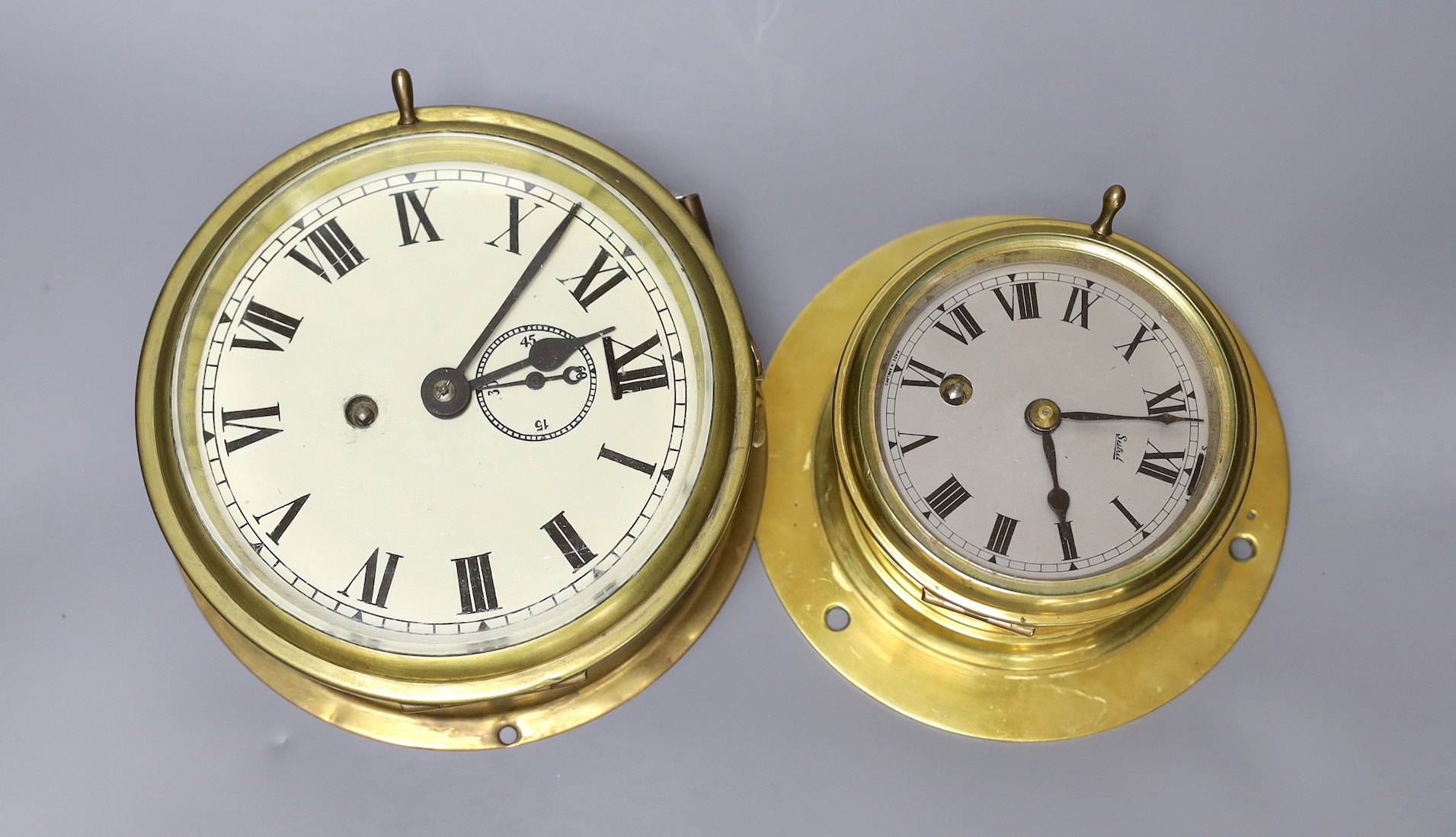 Two brass bulkhead timepieces